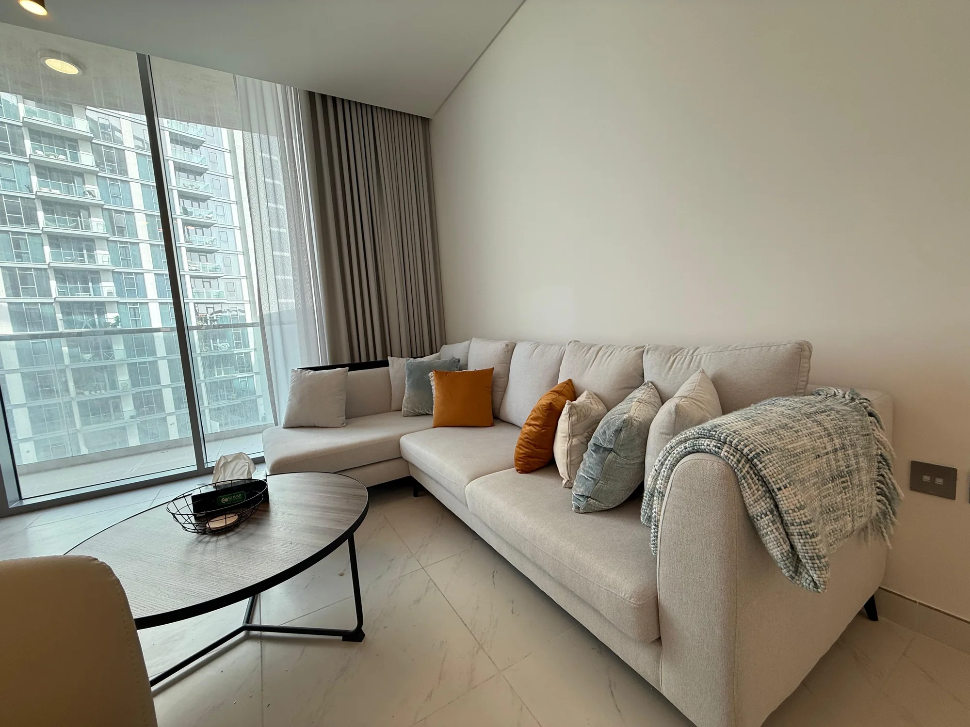Living room with lagoon-side views